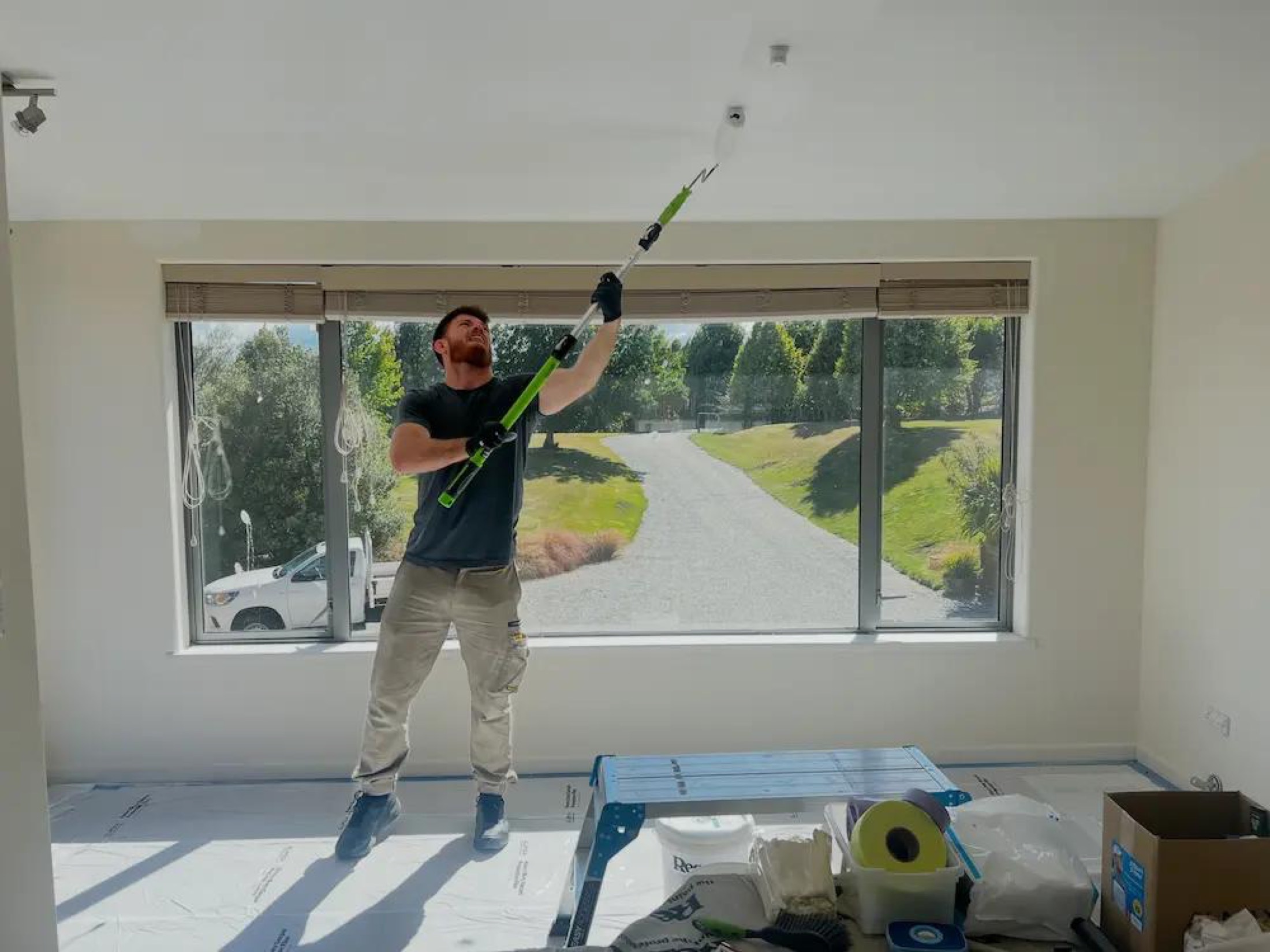 Flat Repaint in Wanaka - Process 5: Painter Rolling Ceiling Interior Wanaka