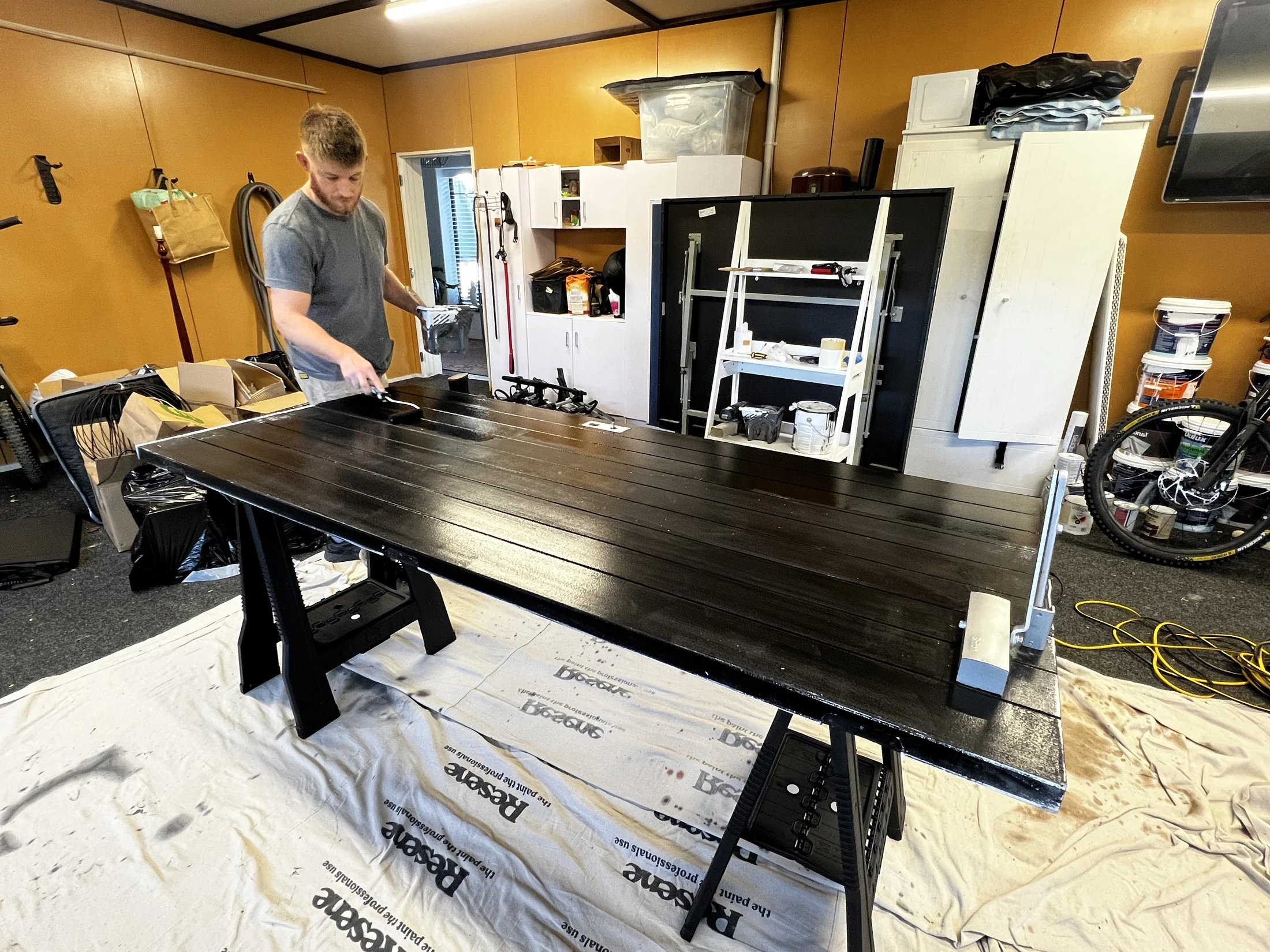 Interior Repaint & Wallpaper, Wanaka - Process 3: Rolling Black Paint On Door Workshop Wanaka