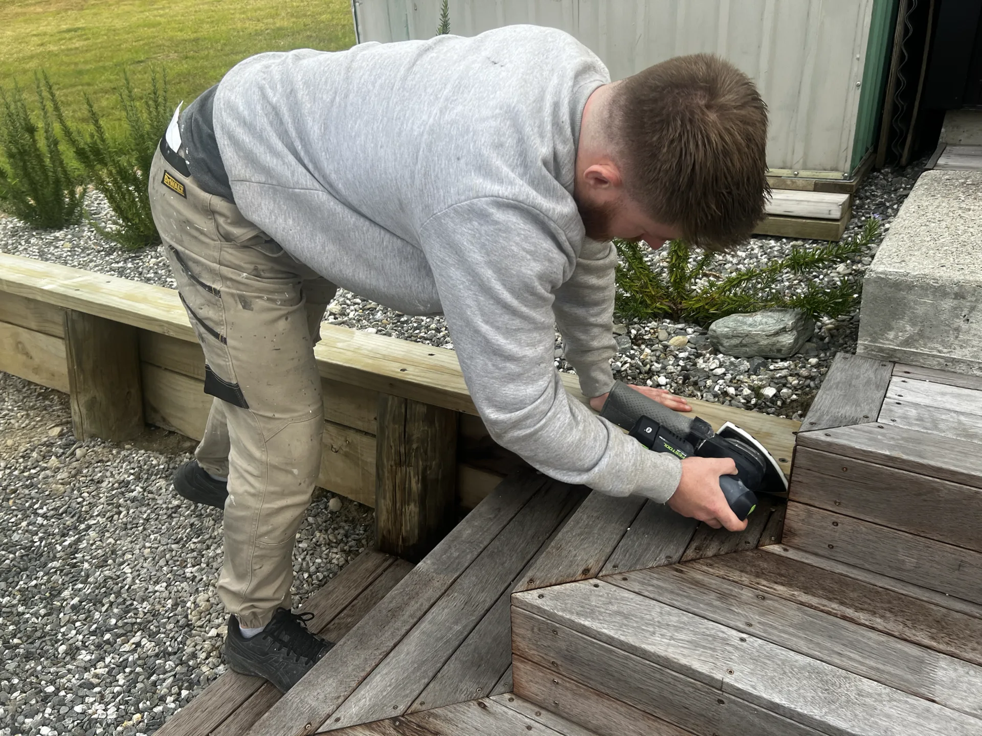 Retaining Wall Repaint in Lake Hawea - Process 4: Sanding Retaining Wall Before Painting Lake Hawea