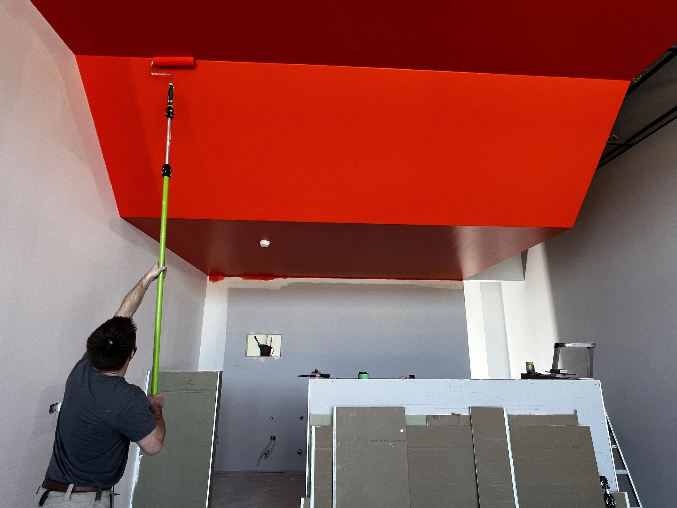 Tank Store Fitout, Three Parks Wanaka - Process 2: Final Coat Orange Feature Ceiling Tank Three Parks Wanaka